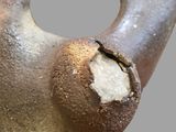 a close up of a metal object with a hole in it