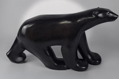 black sculpture of a polar bear on a white background