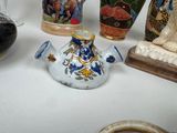 many vases that are sitting on a table