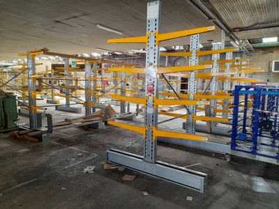 a large warehouse with lots of shelves and pallets