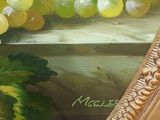 a picture of a painting of grapes in a gold frame