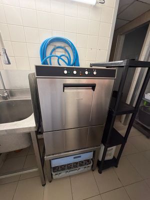 a stainless steel dishwasher in a small kitchen