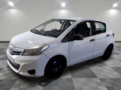 a picture of a white car parked in a garage