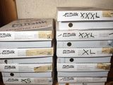 several boxes are stacked on top of each other on a shelf