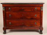 an antique mahogany chest of drawers with marble top