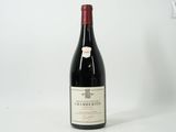 a bottle of wine that is sitting on a table