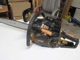 a chainsaw sitting on a table in a garage