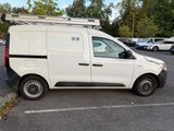 a white van that is parked in a parking lot