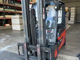 a fork lift truck that is parked in a warehouse