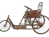 an old fashioned bicycle with a basket on the back of it