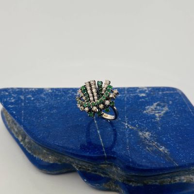 a close up of a ring on top of a blue stone