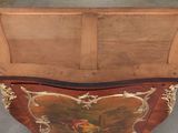 a wooden box that has a painting on it