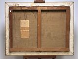 an old wooden easel with a piece of paper on top of it