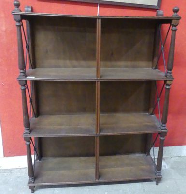 a wooden shelf with a mirror on top of it