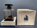 an image of a bottle of perfume sitting on top of a box