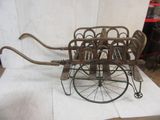 a small wooden cart that is sitting on a table