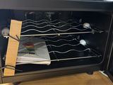 a wine rack in the middle of an open oven