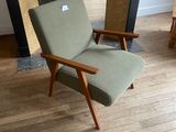 a chair that is sitting in front of a fire place