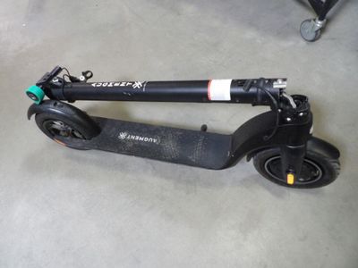 a scooter that is sitting on the floor
