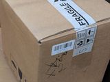 cardboard boxes are stacked on top of each other on the floor