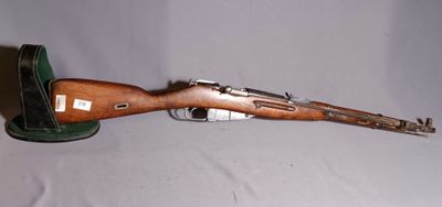 an old rifle with a wooden barrel on a white background
