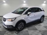 a picture of a white car parked on a checkered floor