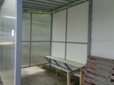 a table that is sitting under a metal structure