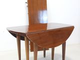 a small table with a mirror on top of it