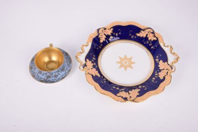 a blue and gold plate with a gold star on it