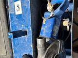 a blue box with tools in it sitting on the floor