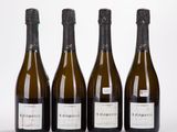 trois bouteilles de vin posées l'une à côté de l'autre sur une table