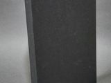 a black book sitting on top of a white table