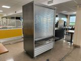 a refrigerator that is in the middle of a room