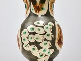 a vase that has a design on it on a table