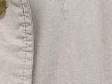 a close up of a button on a white shirt