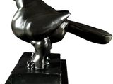 statue of a bird on a marble base on a white background