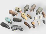 a lot of small figurines of animals on a white surface