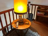a lamp that is sitting on a table in a room