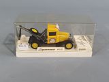 a yellow toy truck with a crane in a clear box