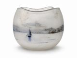 a white vase with a sailboat in the water