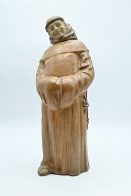 statue of a monk in a robe holding a rosary on a white background