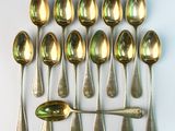 a lot of spoons and spoon spoons on the table