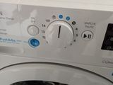 a washing machine that is sitting on top of a table