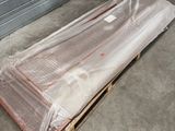 a pile of plastic wrapped up on a pallet in a garage