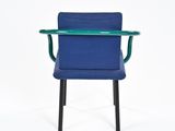 an image of a blue chair with black legs and a green armrest