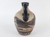 a small vase with a black handle on a white background
