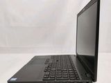 the laptop is sitting on a white surface with a black keyboard