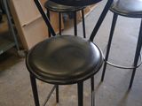 three stools that are sitting in a room
