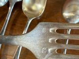 a lot of spoons and spoon spoons on the table
