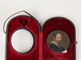a picture of a man with a beard in a red case